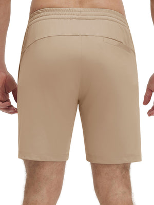 Back lower body shot of model wearing light khaki 4 way stretch breathable workout athletic shorts