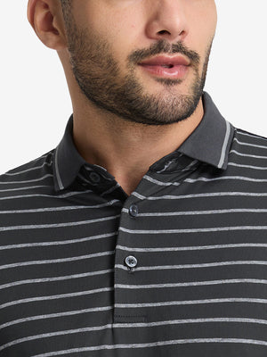 Front shot from nose to chest of model wearing stretch limo/ltgrey heather non-curl ribbed collar striped polo shirts