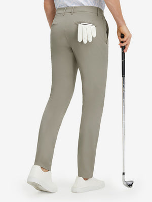Back lower body shot of model wearing khaki grey stretch cotton blend slim fit golf trousers 5 pockets