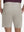 Back lower body shot of model wearing fossil flat front hybrid golf shorts