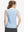 Back upper body shot of model wearing blue plaid women's sleeveless v-neck print golf shirts