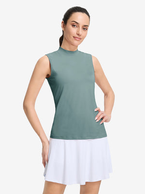 Front upper body shot of model wearing dusty blue women's moisture-wicking mock neck sleeveless golf tops