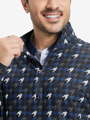 Upper front detail of Full print lightweight quarter zip pullover showing blue/black houndstooth accents