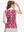 Back upper body shot of model wearing red splatter women's sleeveless v-neck print golf shirts