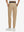 Back lower body shot of model wearing light khaki women's lightweight athletic sweatpants