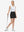 Front full body shot of model wearing black high waist built-in short a-line golf skirt with 5 pockets