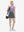 Front full body shot of model wearing dark grey high waist built-in short a-line golf skirt with 5 pockets
