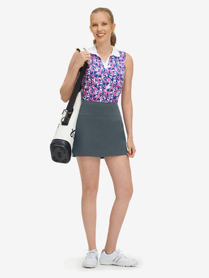 Front full body shot of model wearing dark grey high waist built-in short a-line golf skirt with 5 pockets
