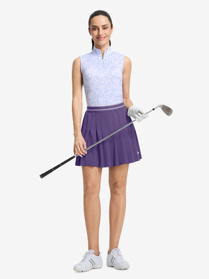 Front full body shot of model with golf gear wearing dark purple women's moisture-wicking athletic tennis skirts