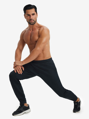 Model performing lunges in soft sweatpants with 4 zipper pockets navy