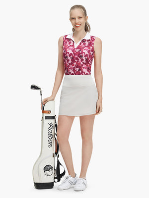 Front full body shot of model exercising in red splatter women's sleeveless v-neck print golf shirts