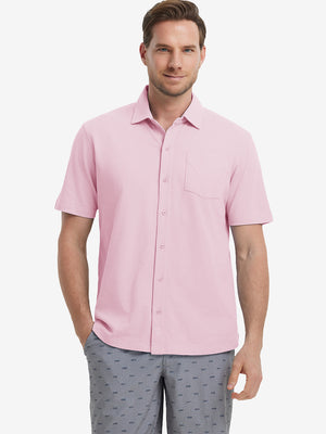Model half-body front view wearing pink cotton blend plain shirt.