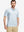 Front half-body of model in white blue florals stretch printed collarless henley golf shirts