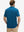 Back upper body shot of model wearing blue cool print plain button up shirts
