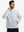 Model with both hands in pockets, wearing soft winter fleece jackets in light grey, warm and relaxed.
