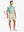 LIGHT KHAKI 4-way Stretch Performance Solid Shorts, golfer full-body front with club, 7 Inch length
