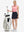 Front full body shot of model with golf gear wearing navy blue women's stretch a-line golf skort with 7 pockets