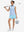 Front full body shot of model with golf gear wearing lake green women's gym golf shorts with liner pocket
