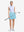 Front full body shot of model with golf gear wearing lake green women's moisture-wicking athletic tennis skirts