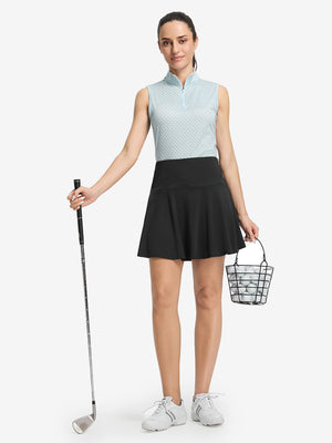 Front full body shot of model wearing black women's high waisted golf skirts with 4 inner pockets