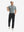 Full front view: model in black stretch quick dry casual golf pants with 4 pockets resting golf club on shoulder.