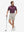 Front full body shot of model wearing fossil flat front hybrid golf shorts