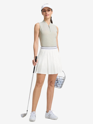 Front full body shot of model with golf gear wearing white women's moisture-wicking athletic tennis skirts