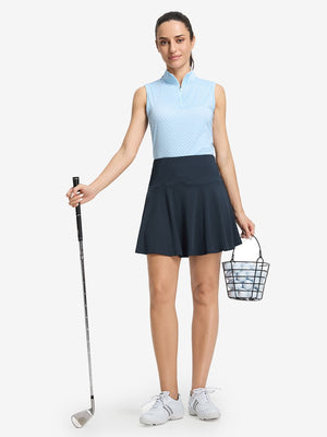 Front full body shot of model wearing navy blue women's high waisted golf skirts with 4 inner pockets