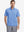 Model half-body front view wearing blue cotton blend plain shirt.