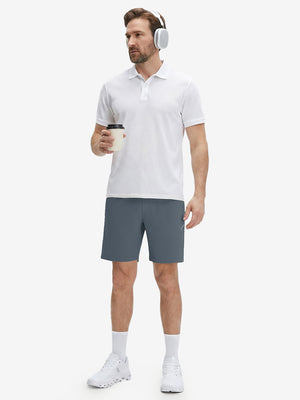 Front full body shot of model exercising in grey blue 4 way stretch breathable workout athletic shorts