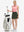 Front full body shot of model with golf gear wearing army green women's stretch a-line golf skort with 7 pockets