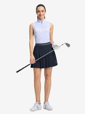 Front full body shot of model with golf gear wearing navy blue women's moisture-wicking athletic tennis skirts