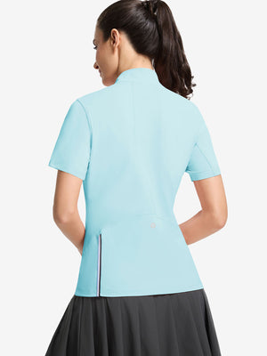 Back upper body shot of model wearing light blue women's breathable 1/4 zip pullover golf shirts