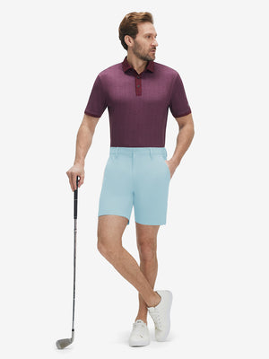 Front full body shot of model wearing light blue flat front hybrid golf shorts