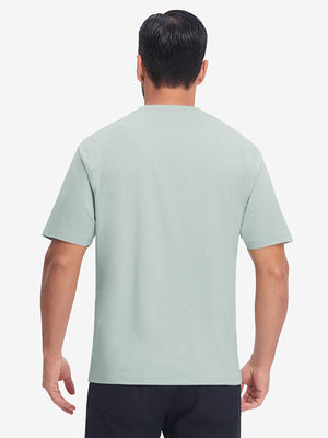 Back upper body view in light green heather of moisture wicking heather round neck athletic t-shirts.
