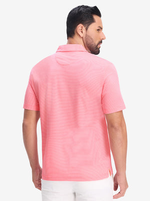 Back half body shot of model wearing pink coral white comfy breathable pin-stripe texture golf polos
