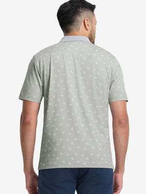 Back upper body shot of model wearing grey golf car premium ribbed collar print polo shirts