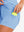 Inner side pocket display in light blue of women's lightweight golf dress with 2 pockets.