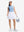 Front full body shot of model wearing light blue women's moisture-wicking mock neck sleeveless golf tops