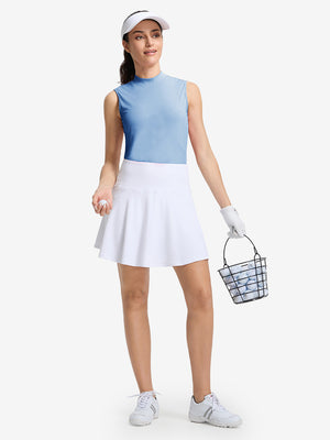 Front full body shot of model wearing light blue women's moisture-wicking mock neck sleeveless golf tops