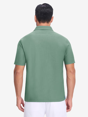 Back upper body shot of model wearing green grey dry fit waffle textured collared golf shirts