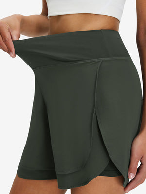 Detail view of elastic waistband on army green women's gym golf shorts with liner pocket
