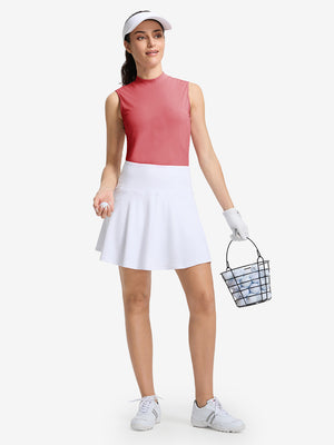 Front full body shot of model wearing pink women's moisture-wicking mock neck sleeveless golf tops