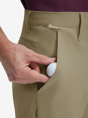 Detail view of front pocket on khaki flat front hybrid golf shorts