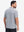 Back half body shot of model wearing navy white comfy breathable pin-stripe texture golf polos