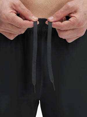 Close-up of elastic waistband on black superion softness mesh joggers with zipper pockets