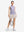 Front full body shot of model exercising in light purple white women's q-zip pin striped texture golf shirts