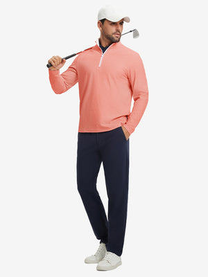 Full-body shot of model holding golf club, dressed in full print quarter zip pullover in red line.
