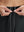 Detail view of elastic waistband on black women's lightweight athletic sweatpants
