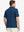 Rear half-body view of Everyday Solid Jersey Polo in BLUE, showcasing clean lines and shape.